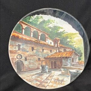 Ceramic plate featuring a scene of the Eremo delle Carceri in Assisi, Italy